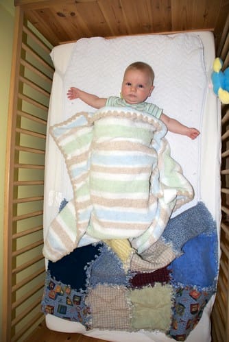 Damien in his Crib